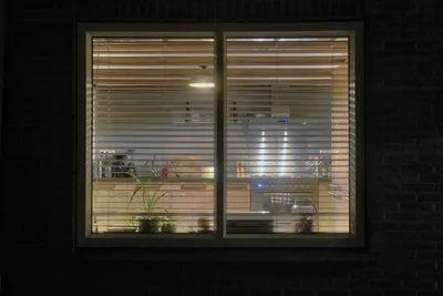 Cozy wooden kitchen, view from outside in the evening. modern retro interior