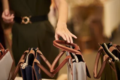 Woman Choosing New Purse